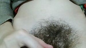 Hairy pussy aside, girl is showing her hair to her boyfriend to impress him.