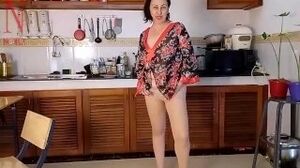 Housewife in pantyhose in the kitchen. Naked maid gets an orgasm while cooking.