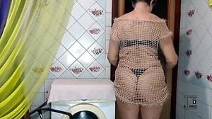 Hot housewife Lukerya loves to create erotic clothes with her own hands in her free time. Fishnet dress and unfinished s